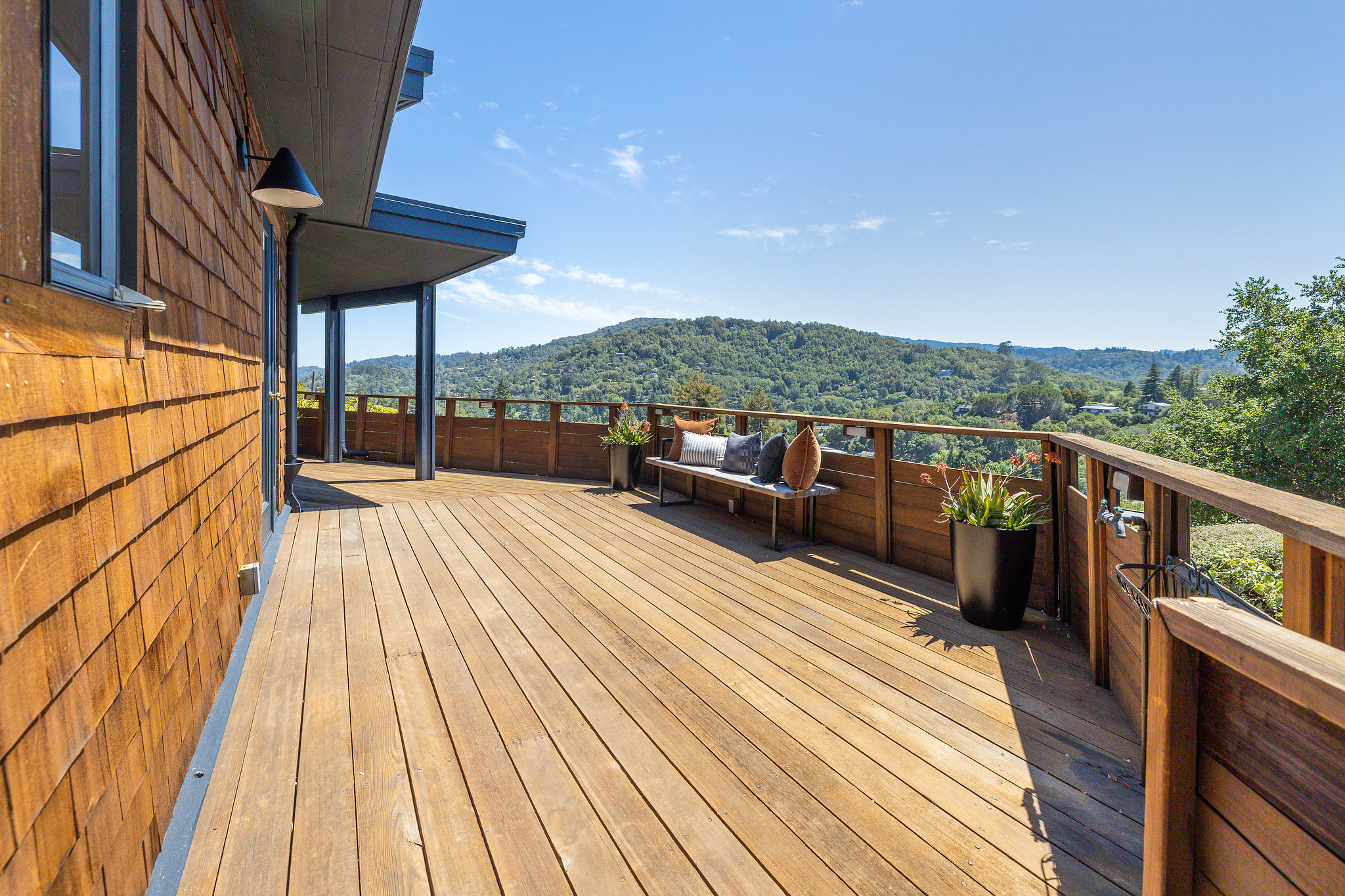 Marin county home showing a wooden deck with views of Mt Tam in the distance