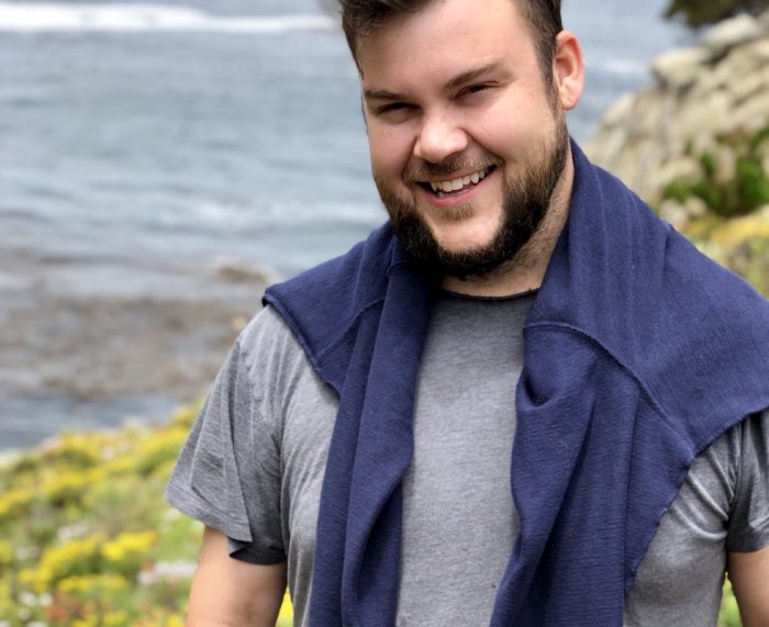 Smiling man at the seashore.