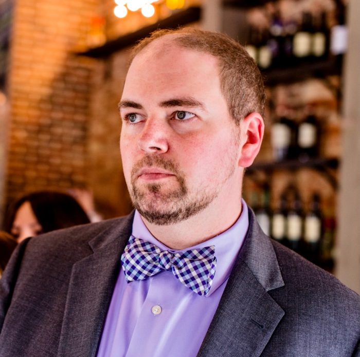 Man with checkered bow tie.