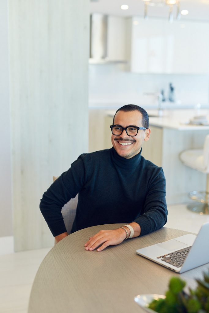 Man at kitchen table with black turtleneck