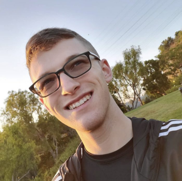 Man with glasses at the park.