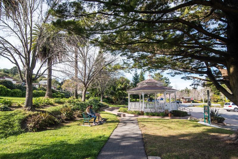 A park in Corte Madera, CA, showing a pavilion and people gathering
