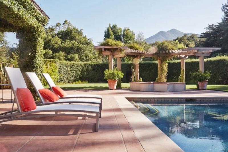 A pool with tanning chairs