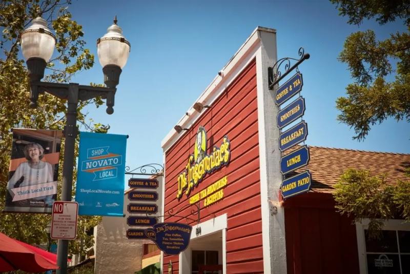 View of shopping in Novato, showing a large red building