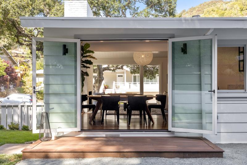 A home in San Rafael, updated and sold by Chris Glave, showing open doors to a dining room
