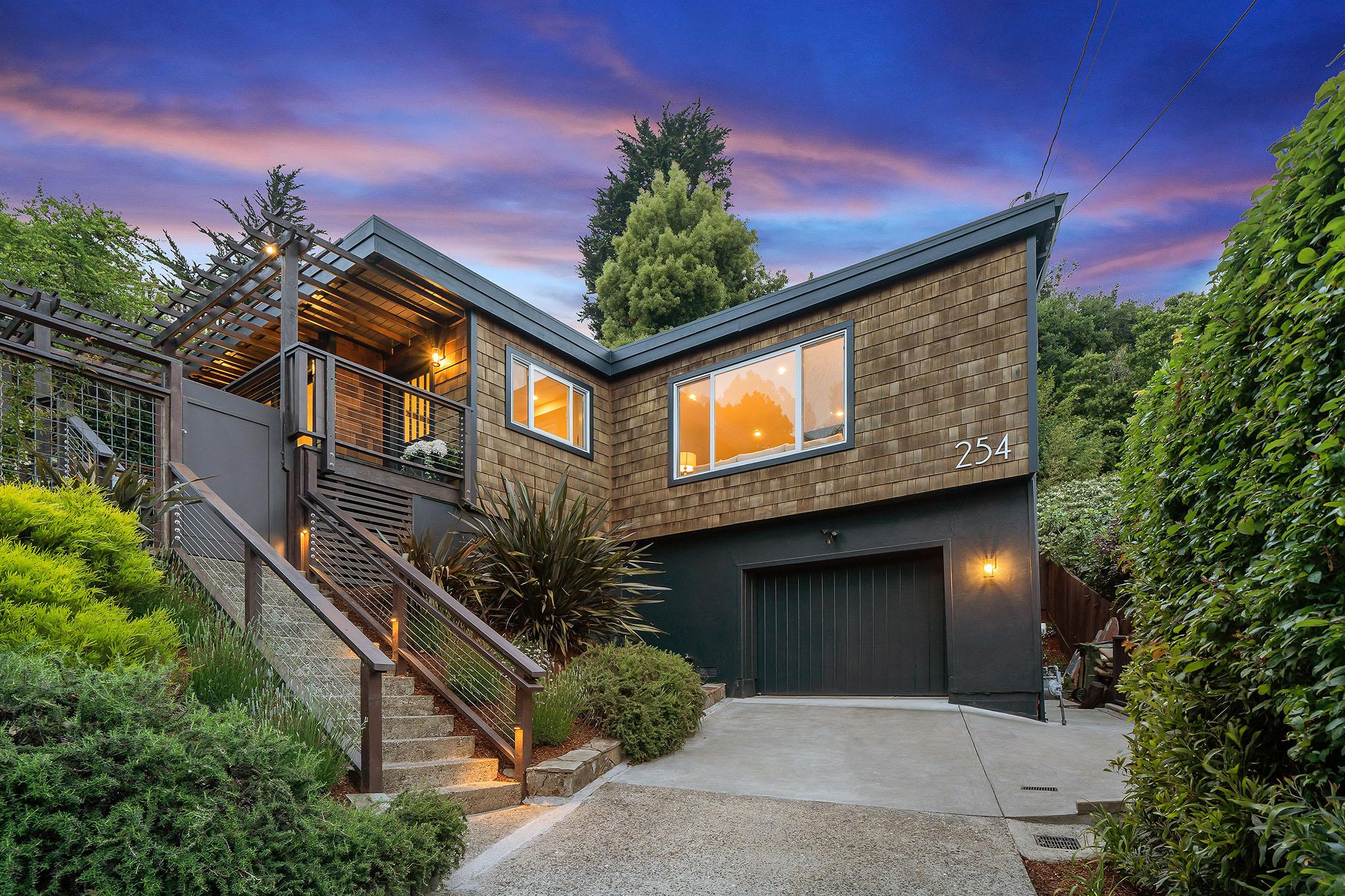 Front exterior view of 254 Morning Sun Ave, showing a multi-level home with wood shingle #1