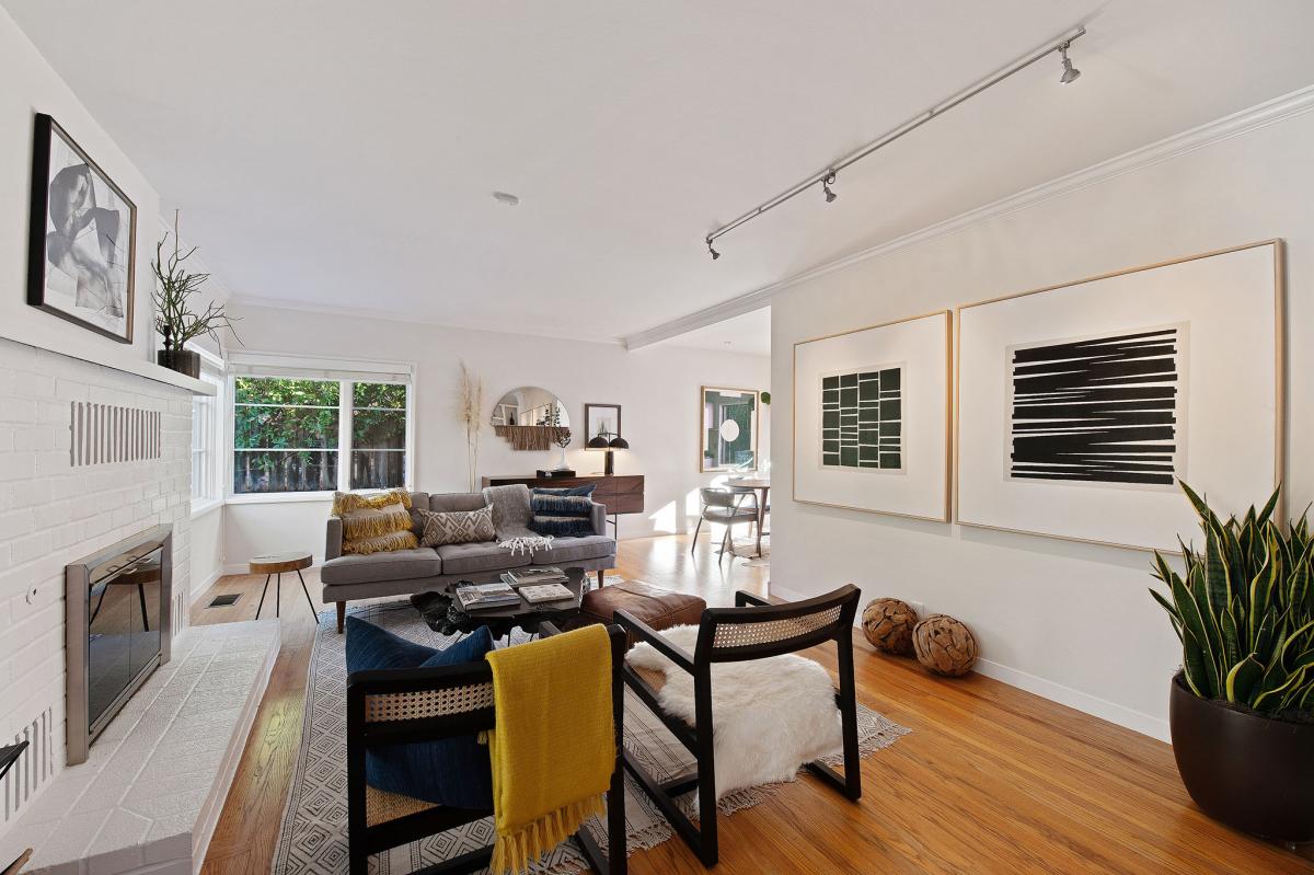 Living area with wood floors and fireplace #6