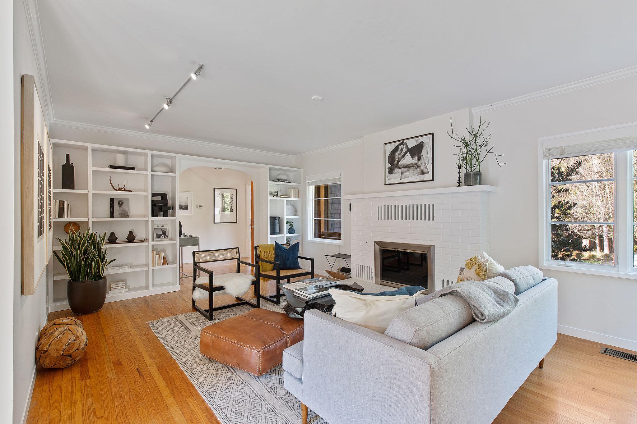 Living room showing built-in shelving and wood floors #8