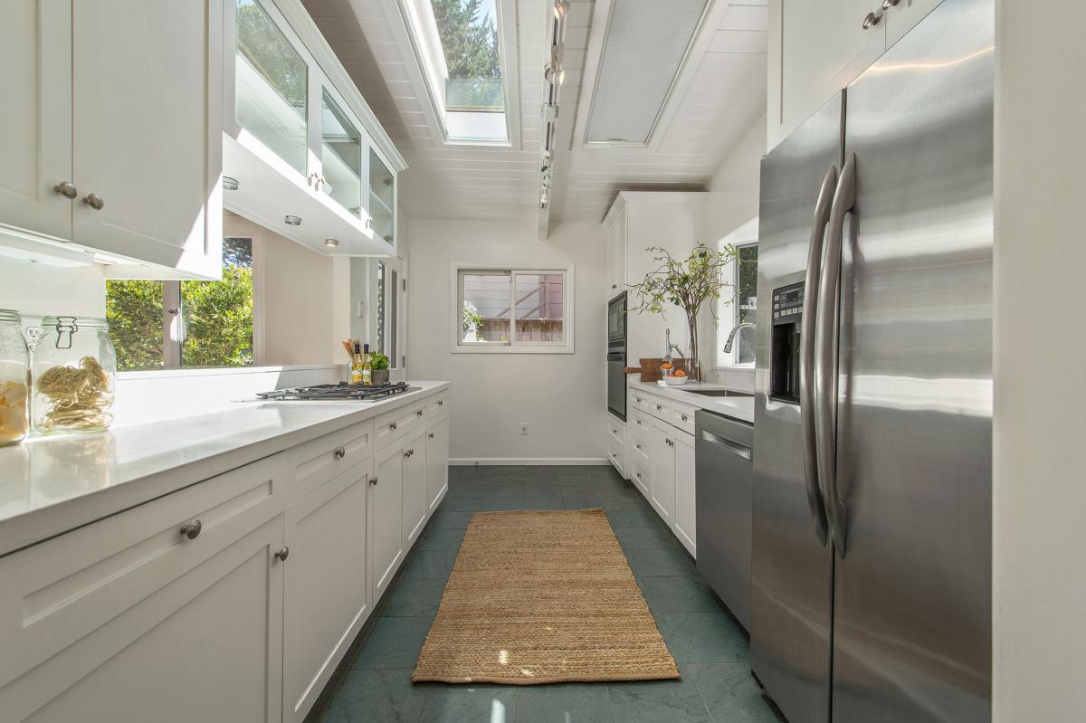 Kitchen, showing a skylight and stainless steel appliances  #6