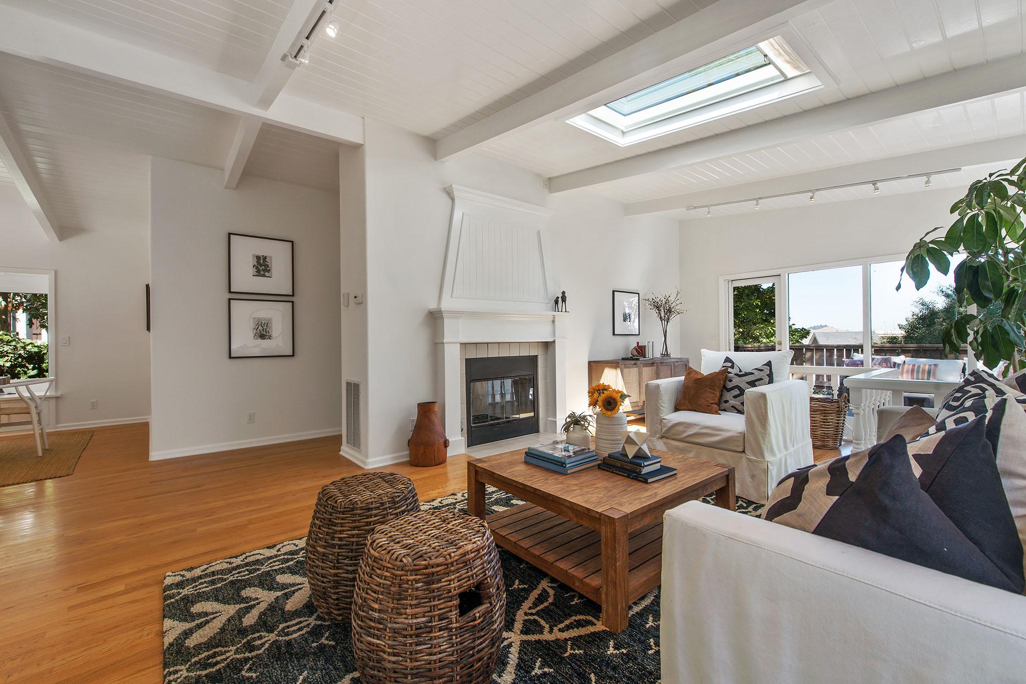 Living area, showing a fireplace and wood floors #5