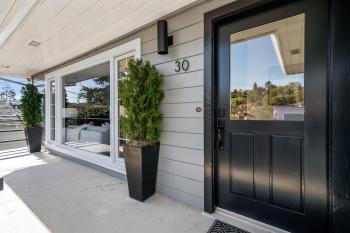 front porch with large window and potted plants #2