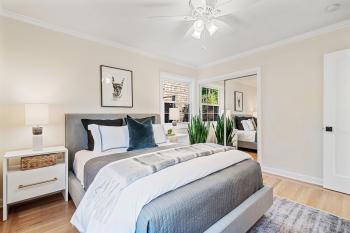 bedroom with mirrored closet doors #18